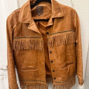 Exquisite like new all leather jacket with fringe trim and studs!